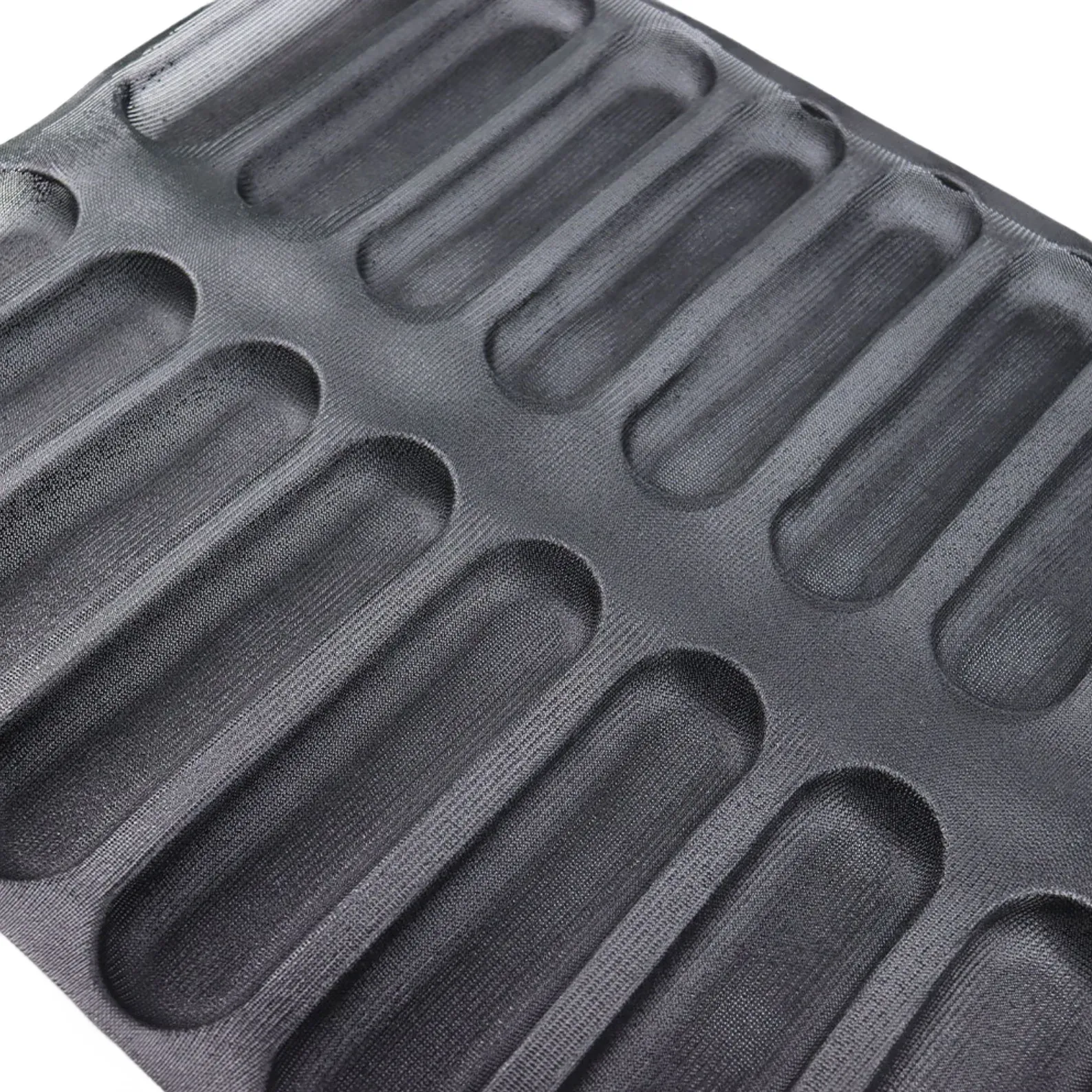 Example of a perforated silicone fiberglass bread mold with rounded long-loaf cavities