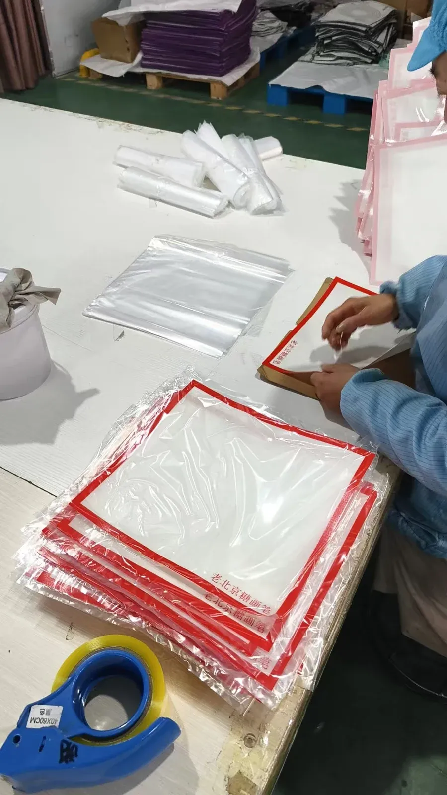 Silicone sugar art mats being placed in individual protective bags