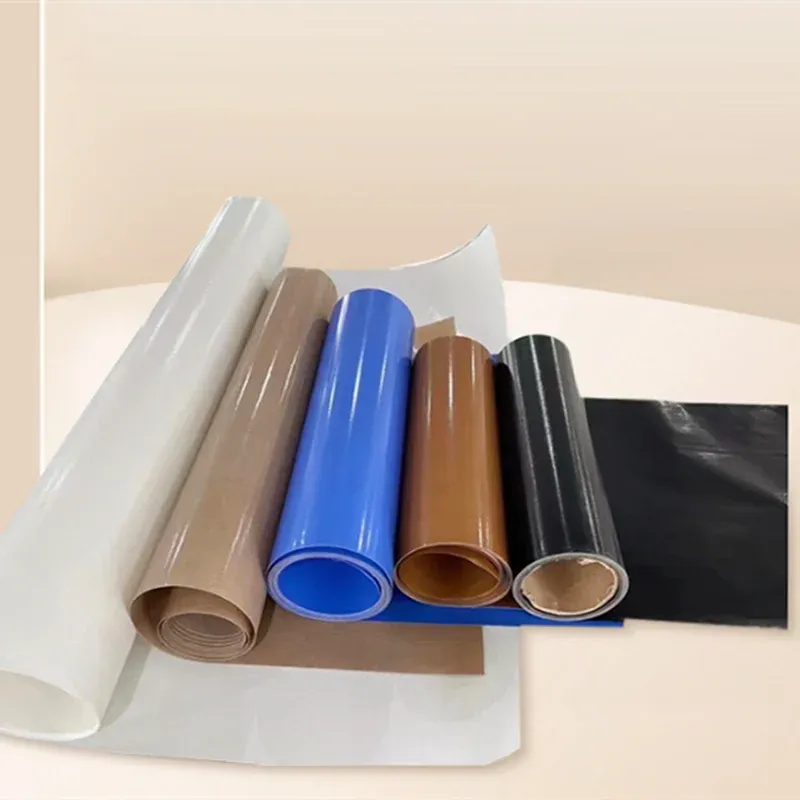 White, blue, brown and black PTFE-coated fabric rolls with loose sheet ends