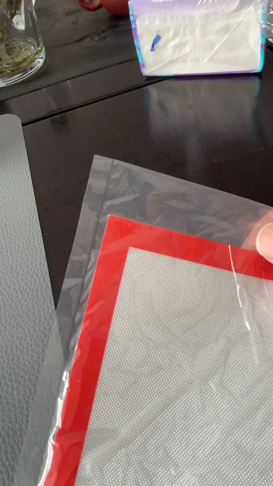 Close-up of the red silicone border and translucent fiberglass-reinforced pastry mat