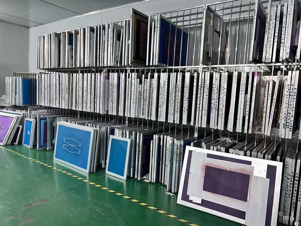 SIFMAT production storage racks holding labelled screen frames and tooling for silicone baking mats