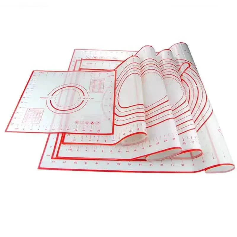 Different sizes of silicone fiberglass pastry mats with printed measurement guides