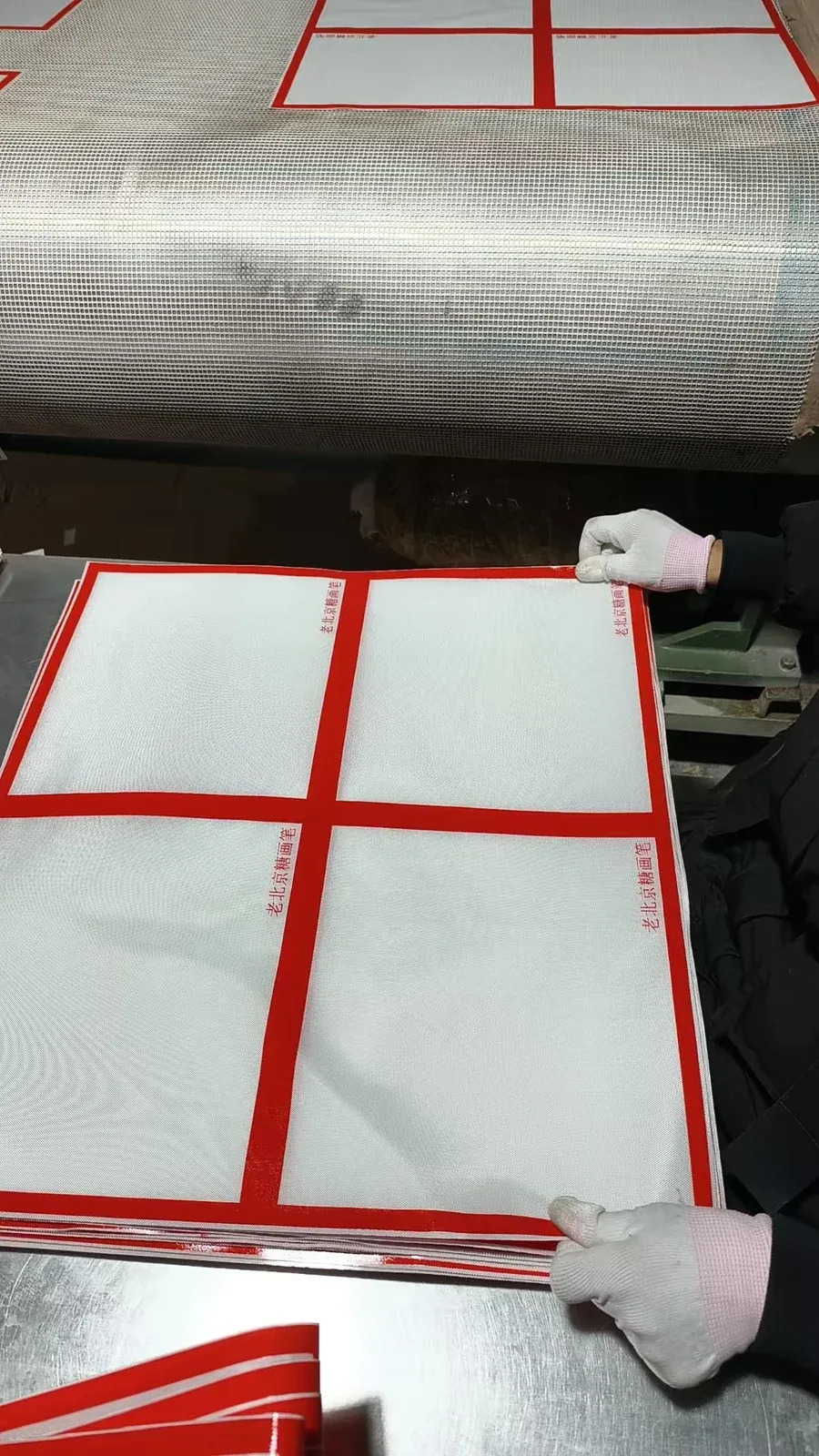 Red-border silicone sugar art mat sheets handled on production equipment